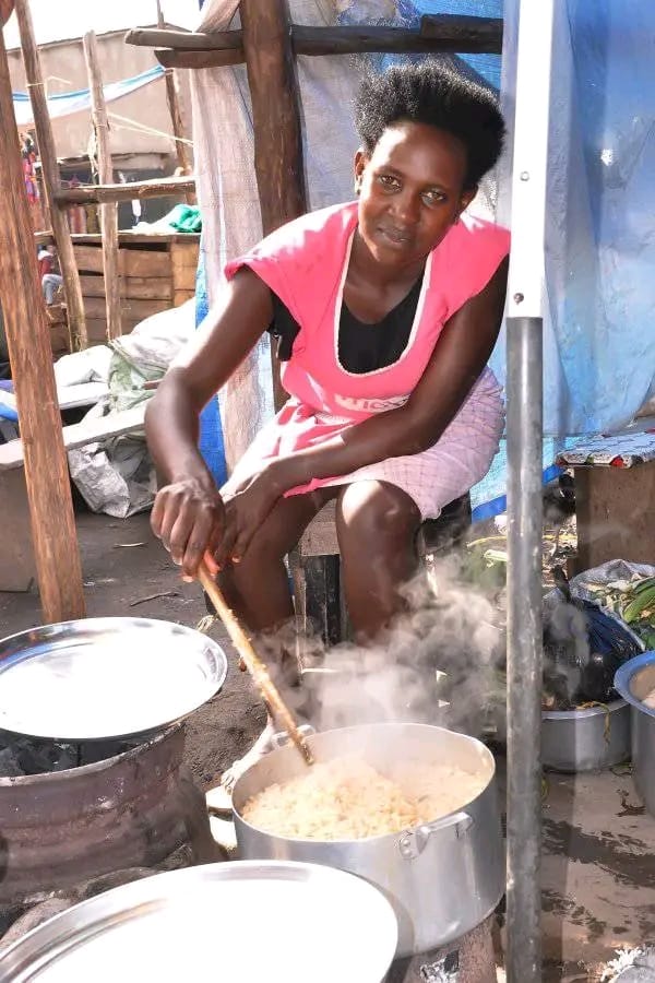A single mother cooking food at her small food-vending business